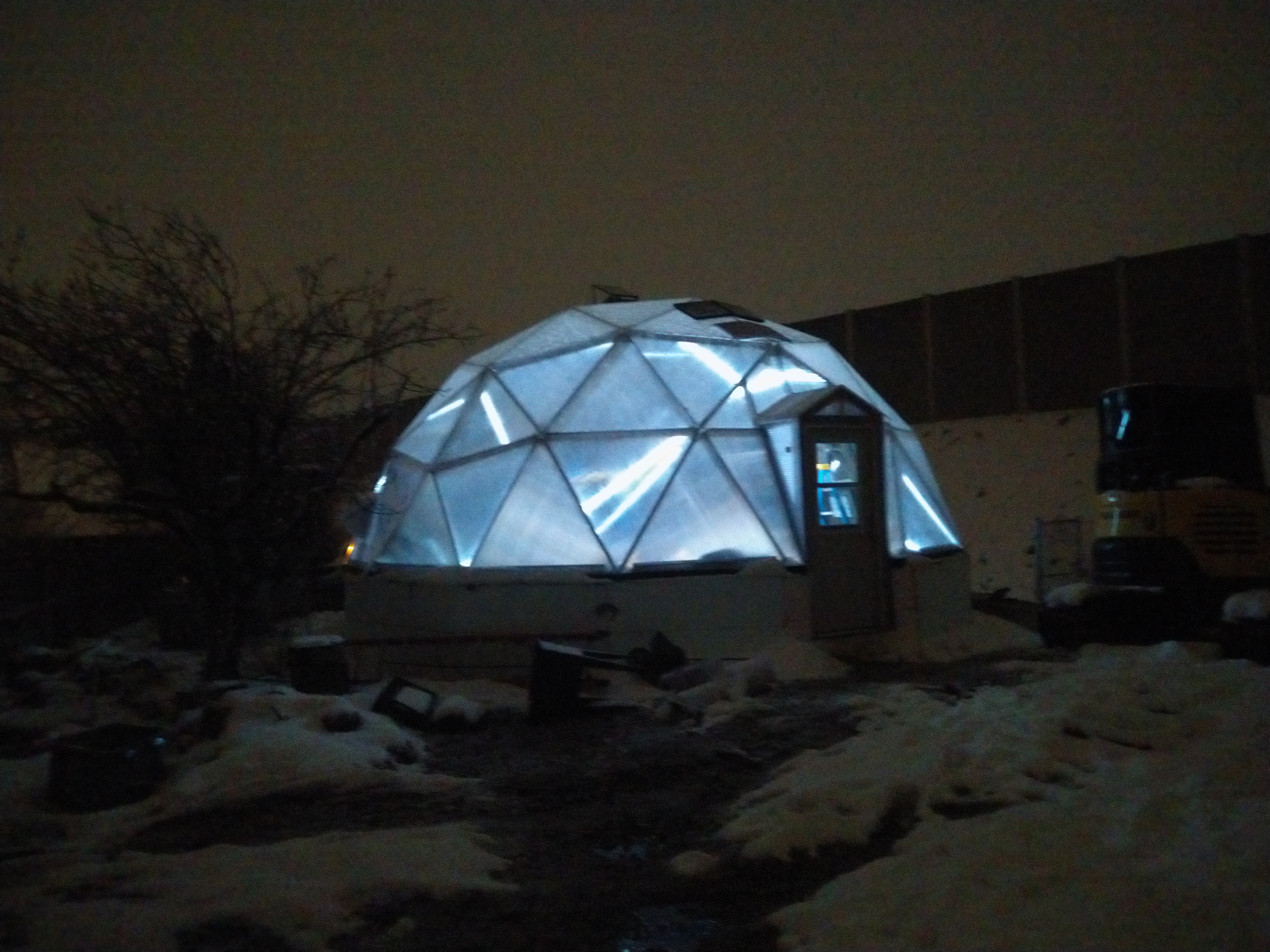 Thistlebridge greenhouse dome glowing at night